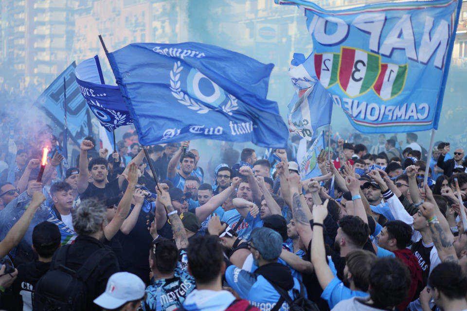 Napoli fans cheer in front of the Diego Armando Maradona stadium, in Naples, Italy, Thursday, May 4, 2023. (AP Photo/Andrew Medichini)