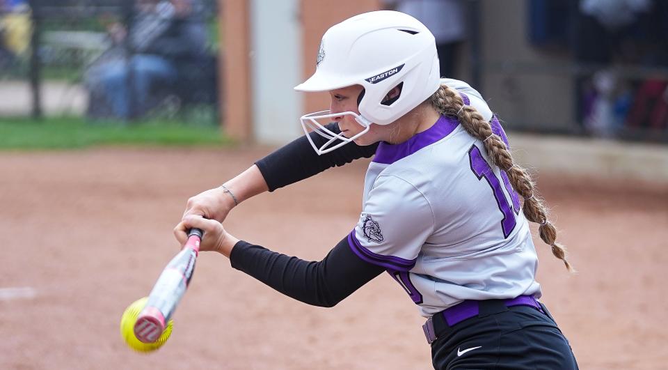 Brownsburg Izzy Neal (10) hits the ball on Saturday, April 22, 2023 at Cherry Tree Softball Complex in Carmel. 