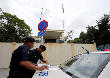 Police officers stand outside North Korea's embassy in Kuala Lumpur, Malaysia March 7, 2017. REUTERS/Lai Seng Sin