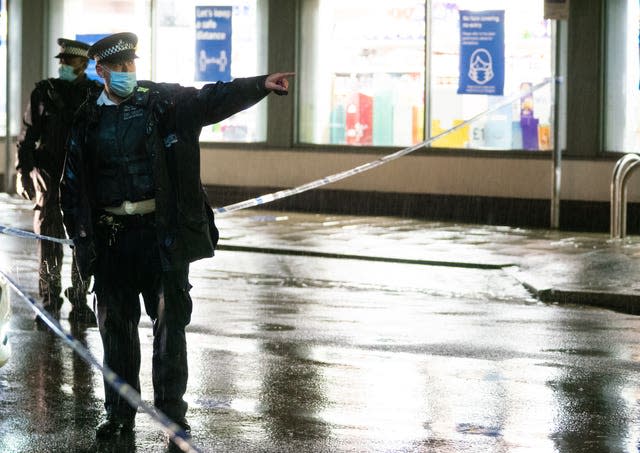 Police at the scene of a stabbing incident on Willesden Lane, in Kilburn, north-west London, on Saturday where one man died 