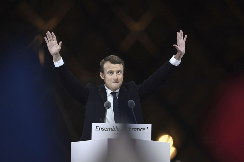 <p>MAY 7, 2017 – French president-elect Emmanuel Macron greets supporters as he arrives to deliver a speech in front of the Pyramid at the Louvre Museum in Paris after the second round of the French presidential election.<br> Emmanuel Macron was elected French president on May 7, 2017 in a resounding victory over far-right Front National (FN – National Front) rival after a deeply divisive campaign. (Photo: Eric Feferberg/AFP/Getty Images) </p>