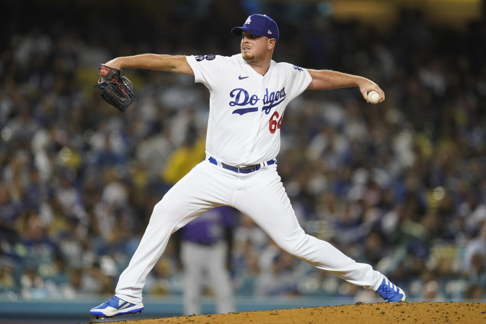 Los Angeles Dodgers relief pitcher Caleb Ferguson (64) throws during the sixth inning of a baseball game against the Colorado Rockies in Los Angeles, Monday, Oct. 3, 2022. (AP Photo/Ashley Landis)