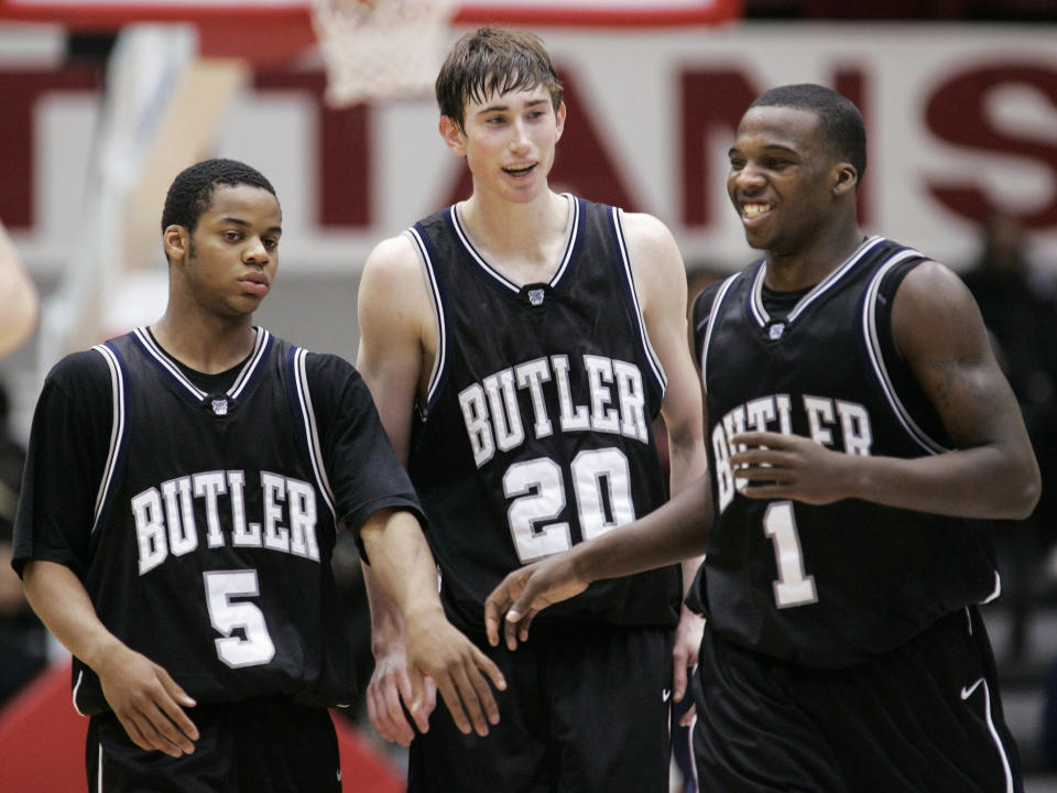 Ronald Nored (5), Gordon Hayward (20) and Shelvin Mack (1) celebrate a Butler win during the 2009 college basketball season. (AP file photo)