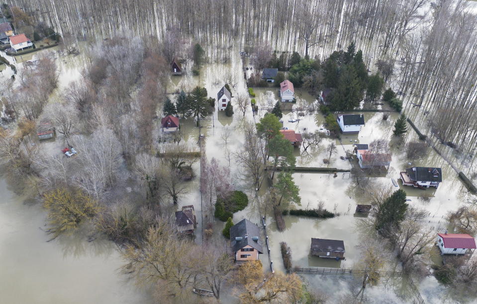 Houses inundated by the River Danube in Venek, 134 kms west of Budapest, Hungary, Wednesday, Dec. 27, 2023. Due to the recent rains and snow, the water level of the Danube has risen. (Csaba Krizsan/MTI via AP)