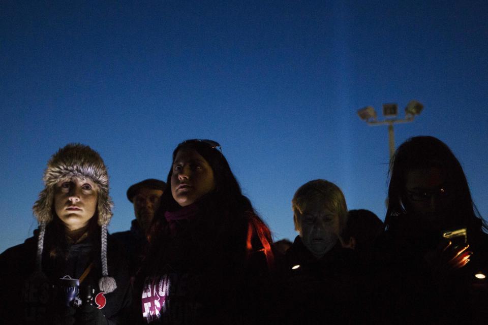 Residents of New Jersey take part in a "Light The Shore" event on the one year anniversary of the landfall of Hurricane Sandy in Seaside Heights, New Jersey