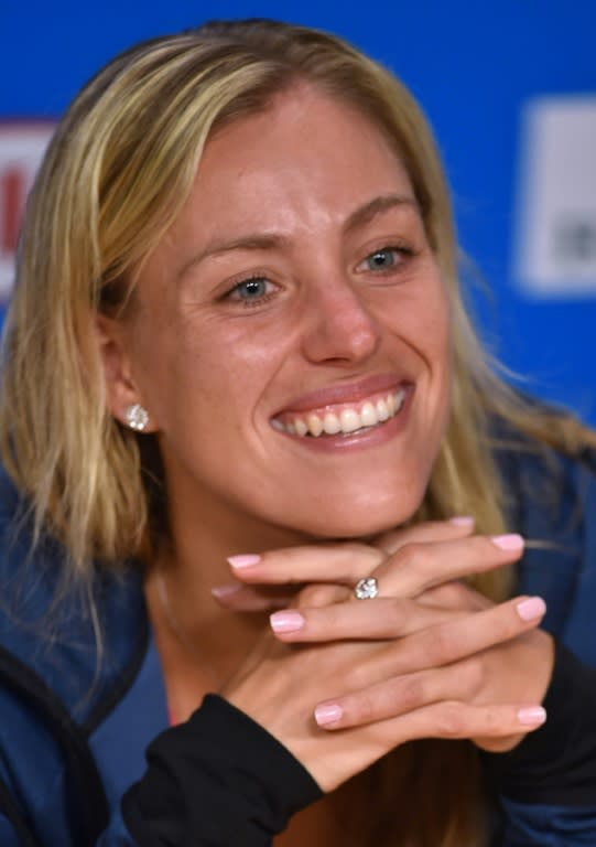 Angelique Kerber of Germany smiles during the post-victory press conference after her win over Serena Williams