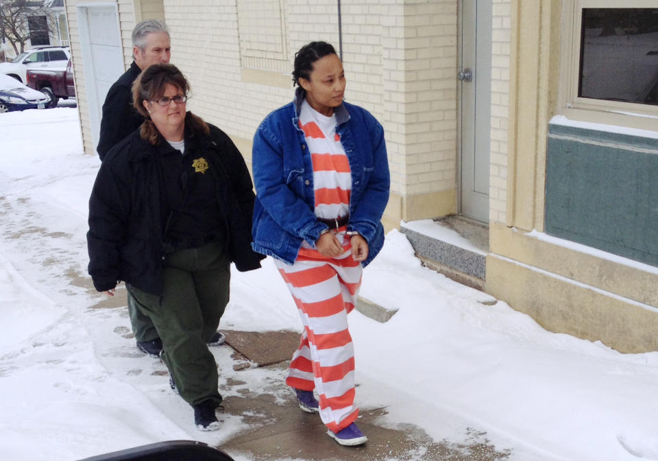 In this image from video provided by KCRG TV, Kristen Smith arrives for a hearing Friday, Feb. 14, 2014 in Tipton, Iowa. Smith, charged with kidnapping her half sister's newborn from Wisconsin, waived the right to challenge her extradition on a warrant from Texas charging her with tampering with government records. Federal prosecutors could take her into custody at any time in the kidnapping case. (AP Photo/KCRG TV, Mark Carlson)