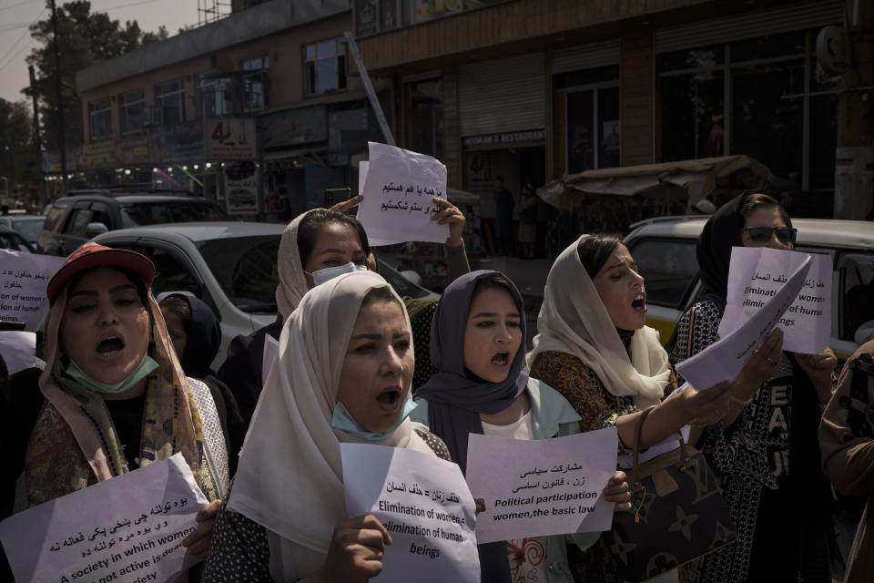 Women march to demand their rights under the Taliban rule during a demonstration near the former Women's Affairs Ministry building in Kabul, Afghanistan, Sunday, Sept. 19, 2021. The interim mayor of Afghanistan’s capital said Sunday that many female city employees have been ordered to stay home by the country’s new Taliban rulers. (AP Photo)