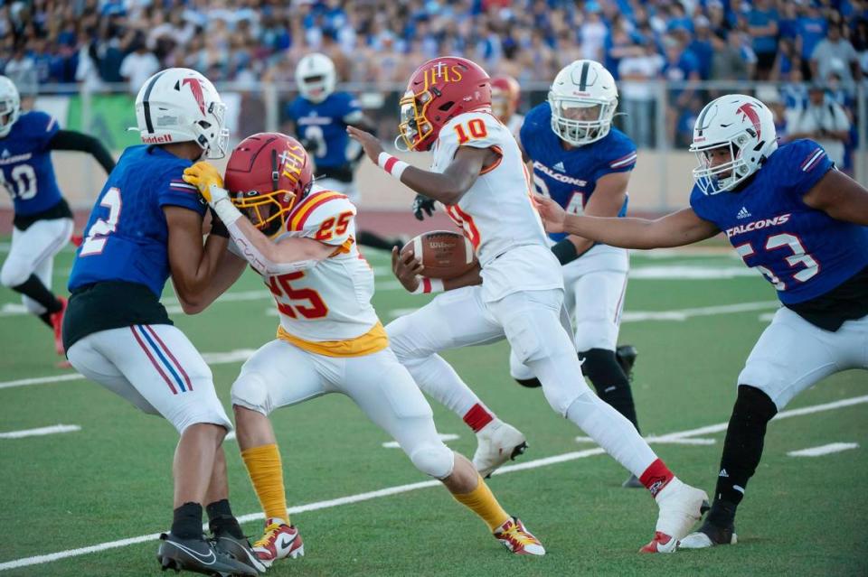 Jesuit Marauders quarterback CJ Lee (10) runs the ball for a 44-yard touchdown in the first half of the Holy Bowl on Saturday, Sept. 9, 2023, at Sacramento City College.