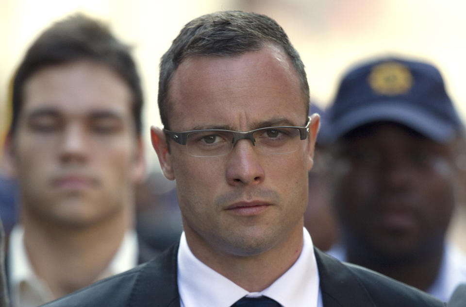 Oscar Pistorius arrives at the high court in Pretoria, South Africa, Monday, March 17, 2014. Pistorius is charged with murder for the shooting death of his girlfriend, Reeva Steenkamp, on Valentines Day in 2013. (AP Photo/Themba Hadebe)