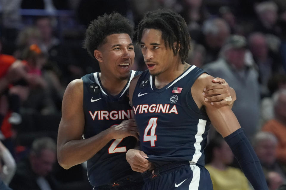 Virginia guard Reece Beekman (2) celebrates with Armaan Franklin (4) after Virginia's win over Wake Forest in an NCAA college basketball game in Winston-Salem, N.C., Saturday, Jan. 21, 2023. (AP Photo/Chuck Burton)