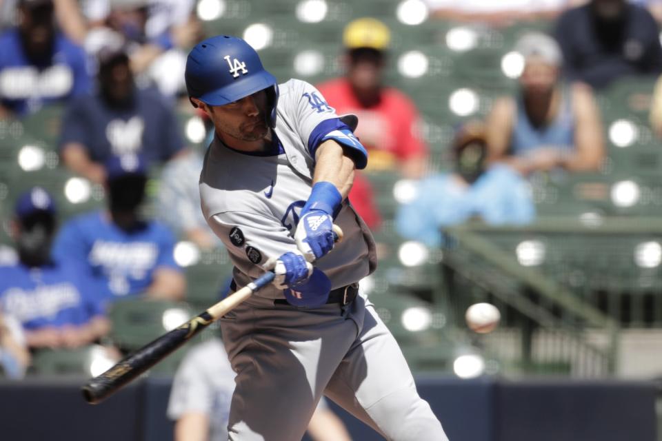 AJ Pollock hits a grand slam during the first inning against the Brewers.