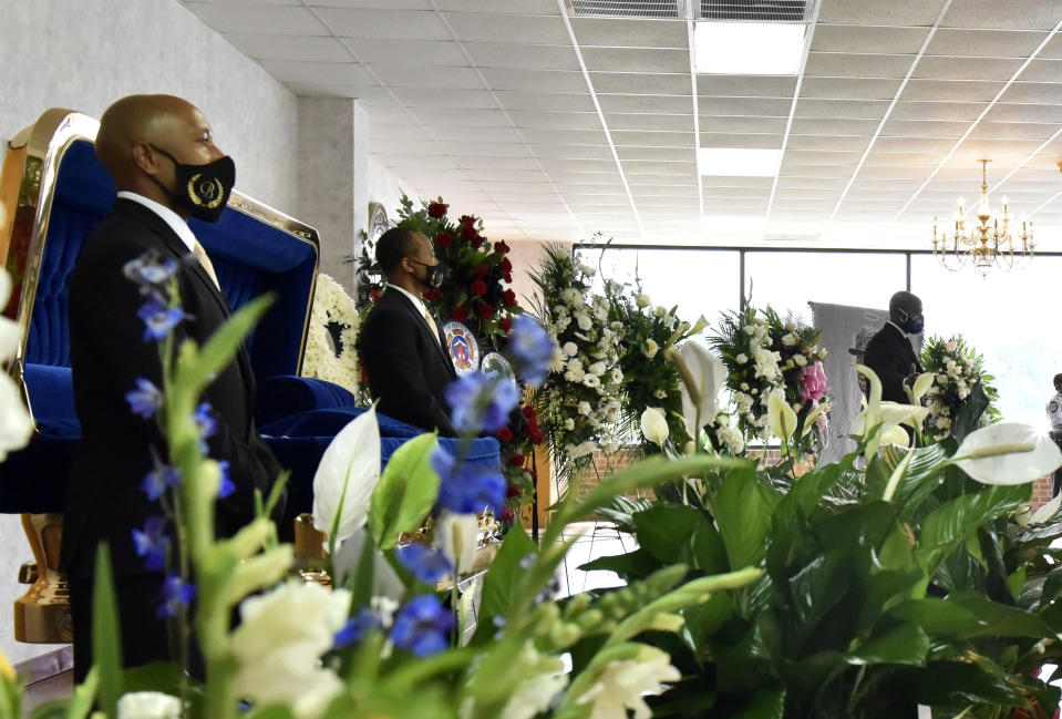 People pay their respects during a memorial service for George Floyd, Saturday, June 6, 2020, in Raeford, N.C. Floyd died after being restrained by Minneapolis police officers on May 25. (Ed Clemente/The Fayetteville Observer via AP, Pool)