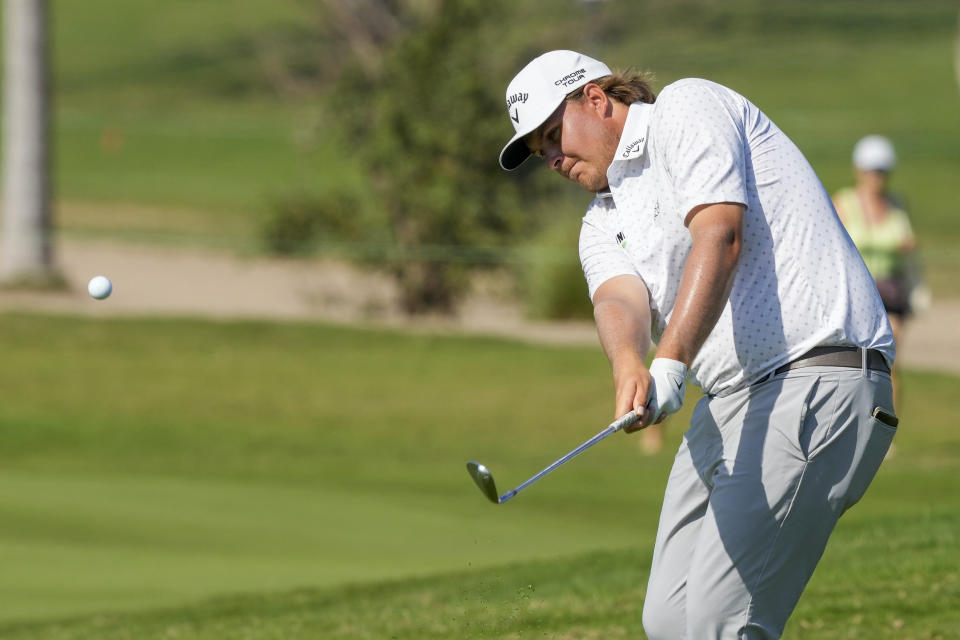 Sami Valimaki, Finland, chips onto the 14th green during the final round of the Mexico Open golf tournament in Puerto Vallarta, Mexico, Sunday, Feb. 25, 2024. (AP Photo/Fernando Llano)