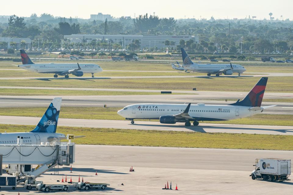 Jets wait on the tarmac at Palm Beach International Airport in West Palm Beach, Florida on January 11, 2023. Thousands of flight delays and cancellations rippled across the U.S. after a computer outage led to a grounding order by the Federal Aviation Administration. 