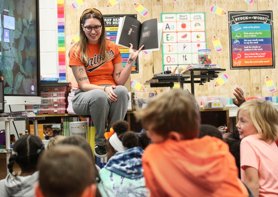 Dunn Elementary econd-grade teacher Samantha Booker uses her voice and facial expressions to help engage her students during a story time. The students then write and illustrate their own story. Oct. 19, 2022. 