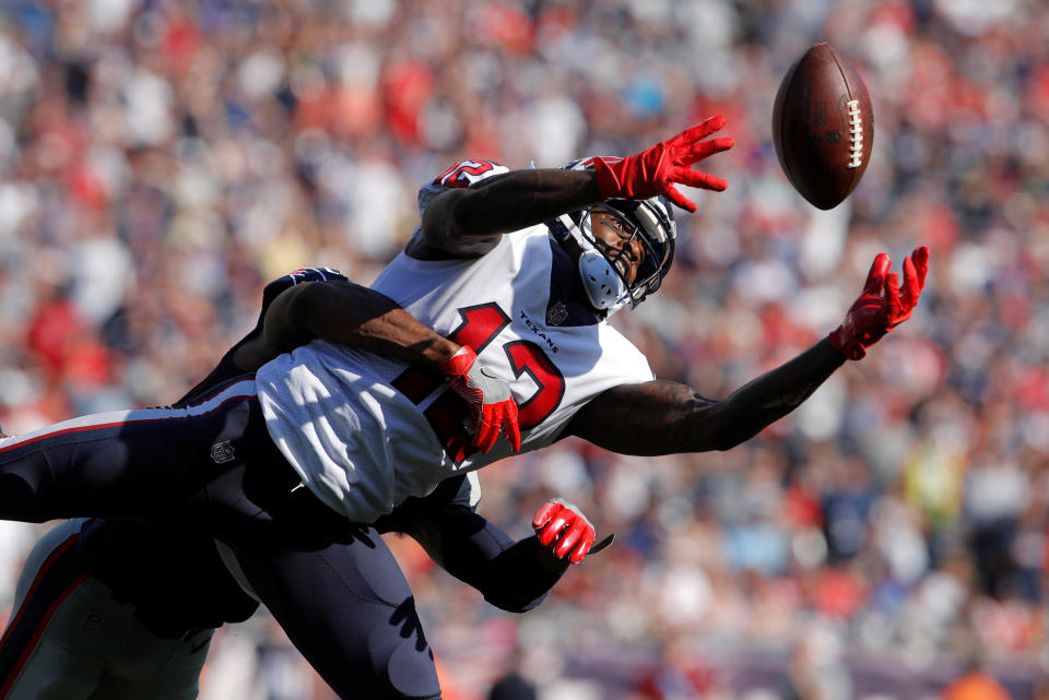 <p>Houston Texans wide receiver Bruce Ellington (12) makes the catch under pressure from the New England Patriots defense in the second half at Gillette Stadium. Mandatory Credit: David Butler II-USA TODAY Sports </p>