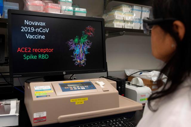 Dr. Nita Patel, Director of Antibody discovery and Vaccine development, looks at a computer model showing the protein structure of a potential corona virus, COVID-19, vaccine at Novavax labs in Rockville, Maryland on March 20, 2020, one of the labs developing a vaccine for the corona virus, COVID-19.