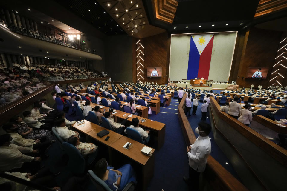 Lawmakers listen as new Philippine President Ferdinand Marcos Jr. delivers his first state of the nation address in, Quezon city, Philippines, Monday, July 25, 2022. Marcos Jr. delivers his first state of the nation address Monday with staunch political capital after a landslide victory but hounded by history as the son of an ousted dictator and multiple dilemmas wrought by the coronavirus pandemic and global fallout from the Ukraine war. (AP Photo/Aaron Favila, Pool)