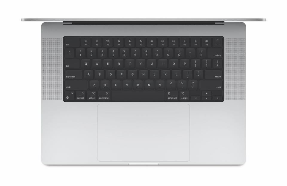 The keyboard in the new MacBook Pro laptops has traditional function keys and Touch ID.