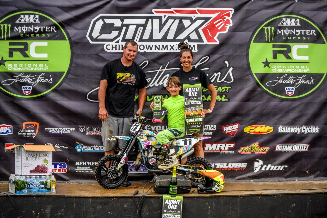 Drake Boatman (center) is joined by his parents, Steve and Colleen, after he finished in sixth place at the AMA Motocross Mid-East Youth Regional Championship in Chillicothe, Ohio, on Saturday, June 12, 2022.