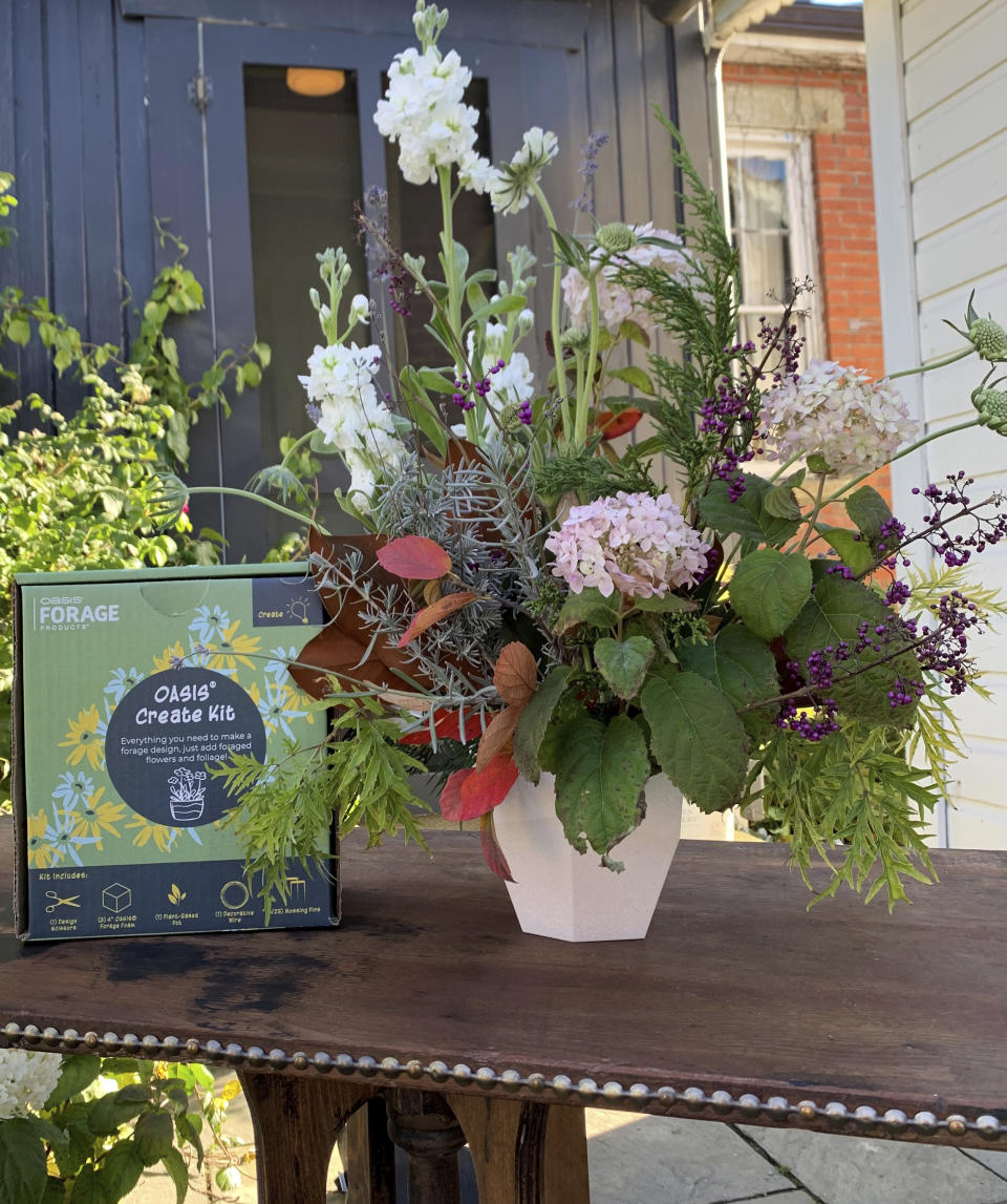 This image provided by OASIS Forage Products shows a floral arrangement, right, created using an OASIS Create Kit. (OASIS Forage Products via AP)