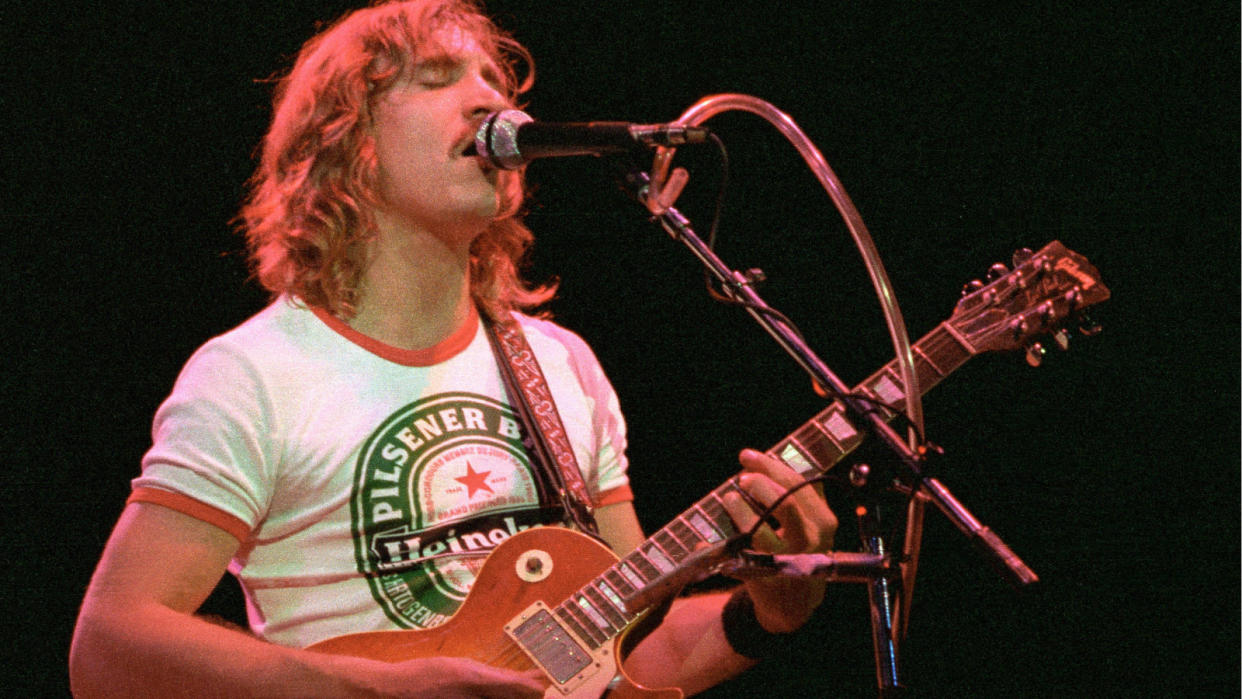  Joe Walsh, performing live onstage, playing Gibson Les Paul guitar 