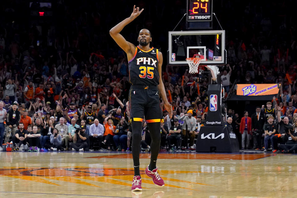 Phoenix Suns forward Kevin Durant (35) motions after making a three pointer against the Los Angeles Clippers during the second half of Game 5 of a first-round NBA basketball playoff series, Tuesday, April 25, 2023, in Phoenix. (AP Photo/Matt York)