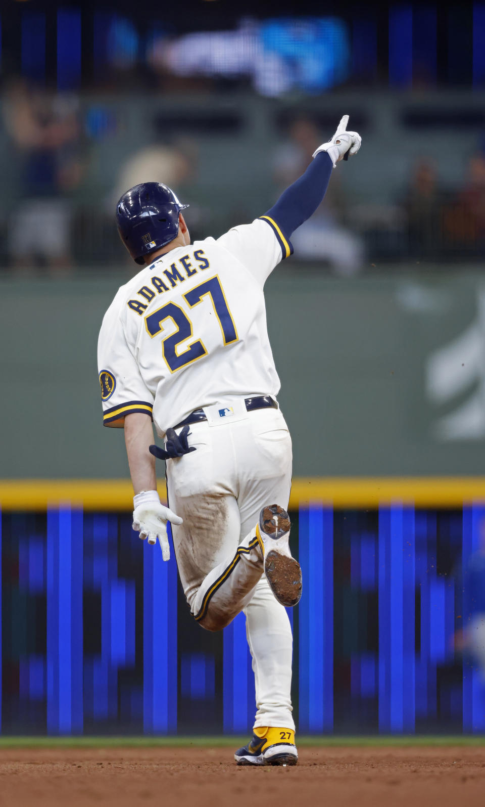 Milwaukee Brewers shortstop Willy Adames points after he hit a grand-slam against the Chicago Cubs during the fourth inning of a baseball game Wednesday, June 30, 2021, in Milwaukee. (AP Photo/Jeffrey Phelps)