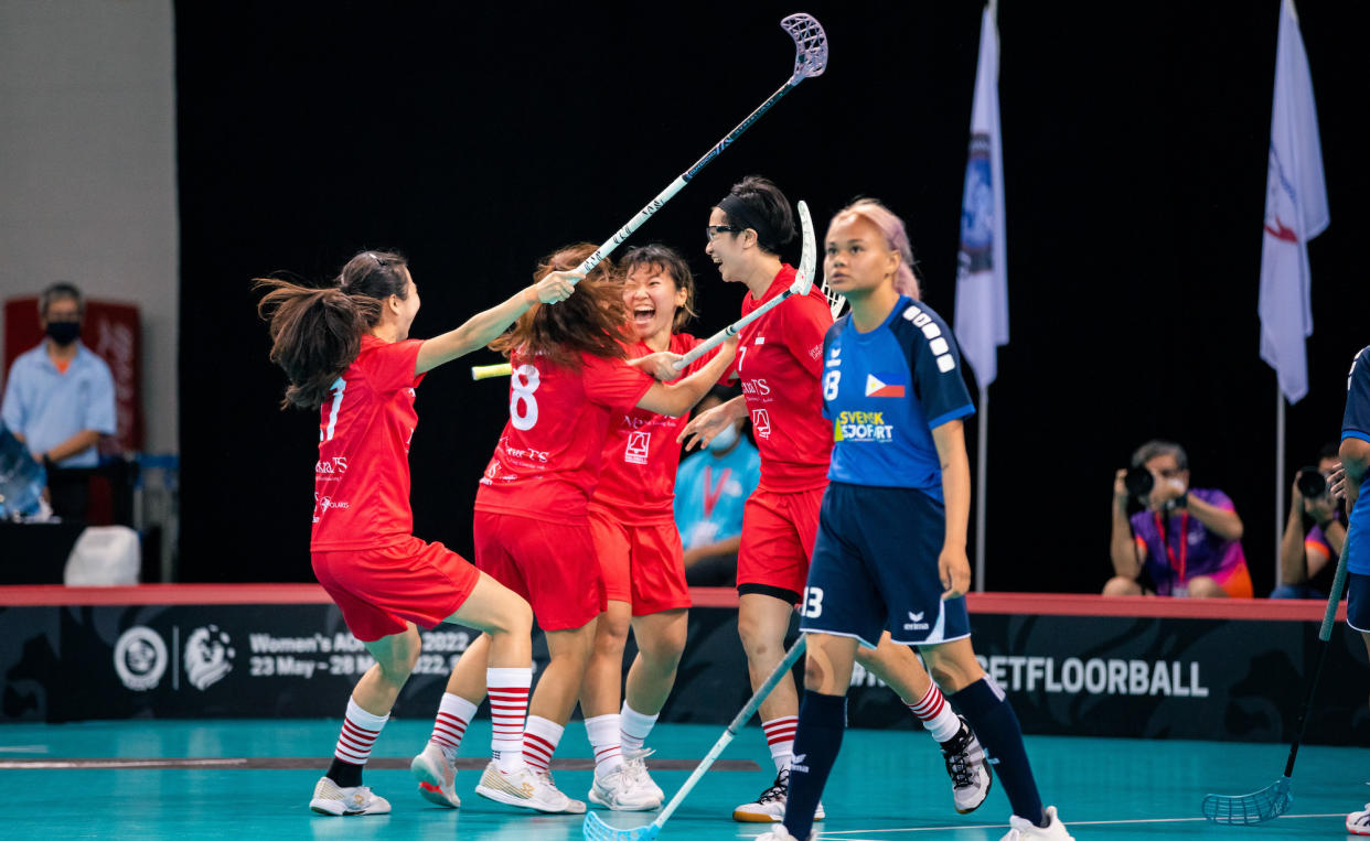 Singapore players celebrating during the Women's Asia Oceania Floorball Confederation Cup final match against the Philippines at OCBC Arena. (PHOTO: Eng Chin An/Singapore Floorball Series)