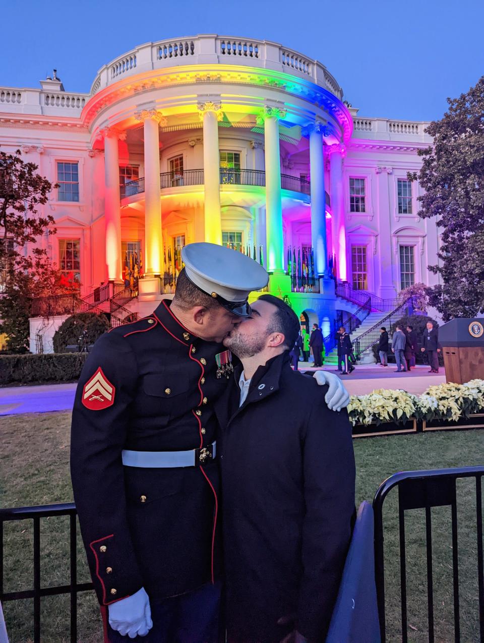 Christian Fuscarino, right, and his husband, Aaron Williams, kiss outside the White House in Washington, D.C. on Tuesday, Dec. 13, 2022 before President Joe Biden signed the Respect for Marriage Act.