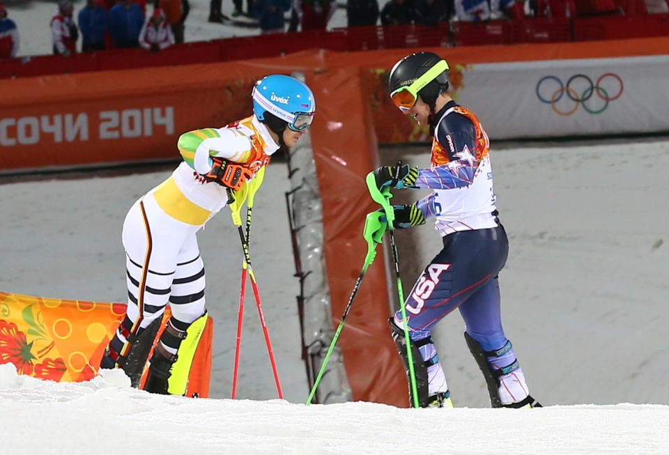 United States' Ted Ligety, right, and Germany's Felix Neureuther talk after they both skied out of the second run of the men's slalom at the Sochi 2014 Winter Olympics, Saturday, Feb. 22, 2014, in Krasnaya Polyana, Russia. (AP Photo/Alessandro Trovati)