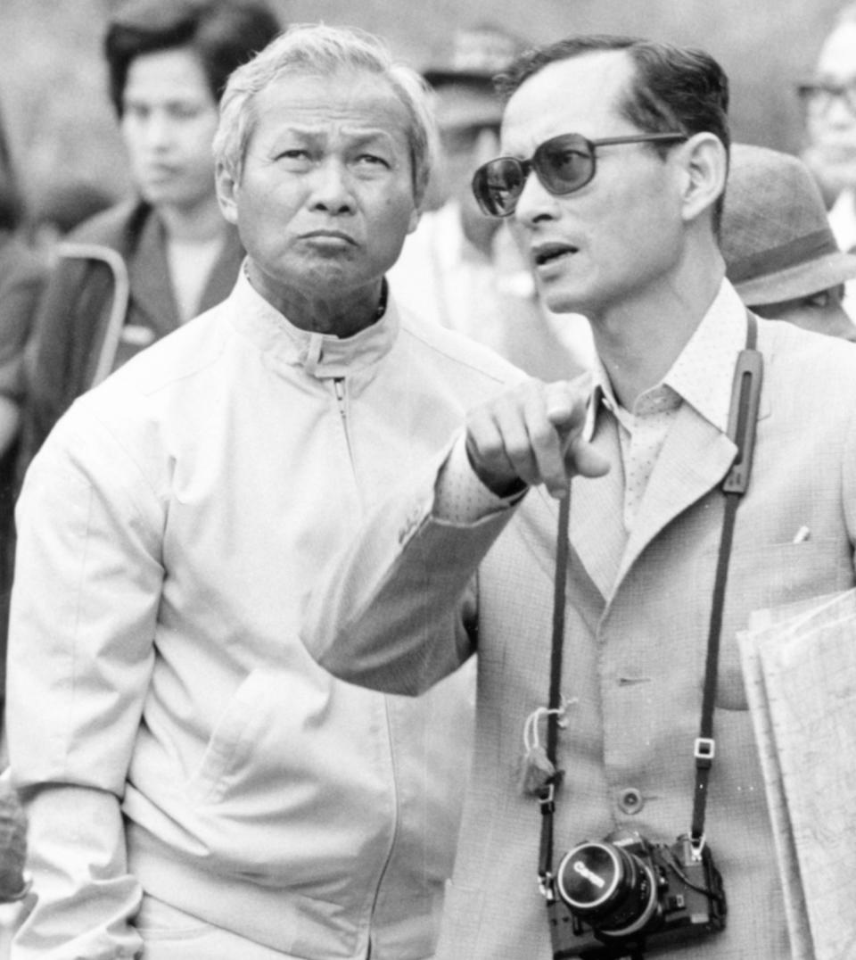 FILE - In this Feb. 16, 1981 file photo, Thailand's King Bhumibol, right, talks with then Prime Minister Prem Tinsulanonda during their visit to an irrigation project in northern Thailand. Prem Tinsulanonda, one of Thailand's most influential political figures over four decades who served as army commander, prime minister and adviser to the royal palace, has died at age 98. Thai media reported he died Sunday morning, May 26, 2019, in a Bangkok hospital, and an official announcement is expected. (AP Photo/Jeff Robbins, File)