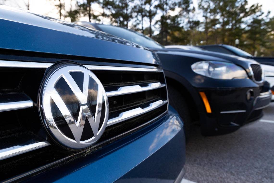 A Volkswagen SUV is parked next to a BMW SUV in Blythewood, South Carolina, before a town hall about the incoming Scout Motors plant in the town on Monday, March 13, 2023. Scout Motors is a Volkswagen brand of electric SUVs and trucks.