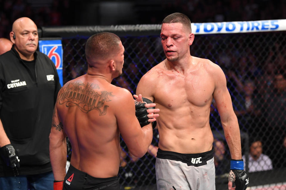 ANAHEIM, CALIFORNIA - AUGUST 17:  (R-L) Nate Diaz and Anthony Pettis embrace after their welterweight bout during the UFC 241 event at the Honda Center on August 17, 2019 in Anaheim, California. (Photo by Josh Hedges/Zuffa LLC/Zuffa LLC via Getty Images)