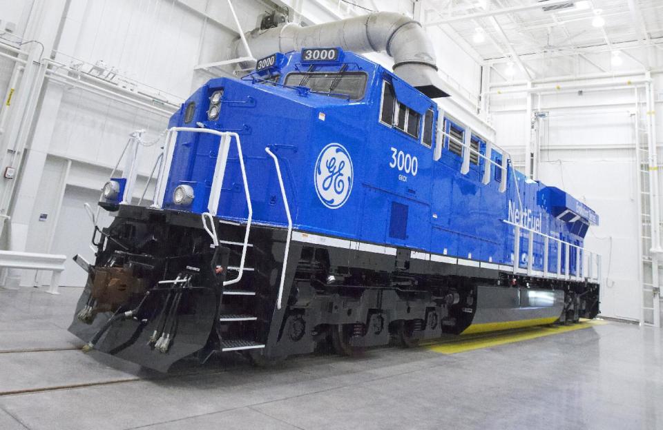 This photo from Sept. 14, 2013, which was provided by General Electric, shows an experimental natural gas locomotive in Erie, Pennsylvania. The diesel locomotives that became freight railroads’ workhorse after World War II could be replaced in the next few years by units like this that burn a mix of natural gas and diesel. The switch could likely reduce fuel costs and pollution significantly while allowing railroads to take advantage of abundant domestic supplies of natural gas. But many questions about using natural gas locomotives remain unanswered, and those could easily derail the idea. (AP Photo/General Electric, Mark Fainstein)