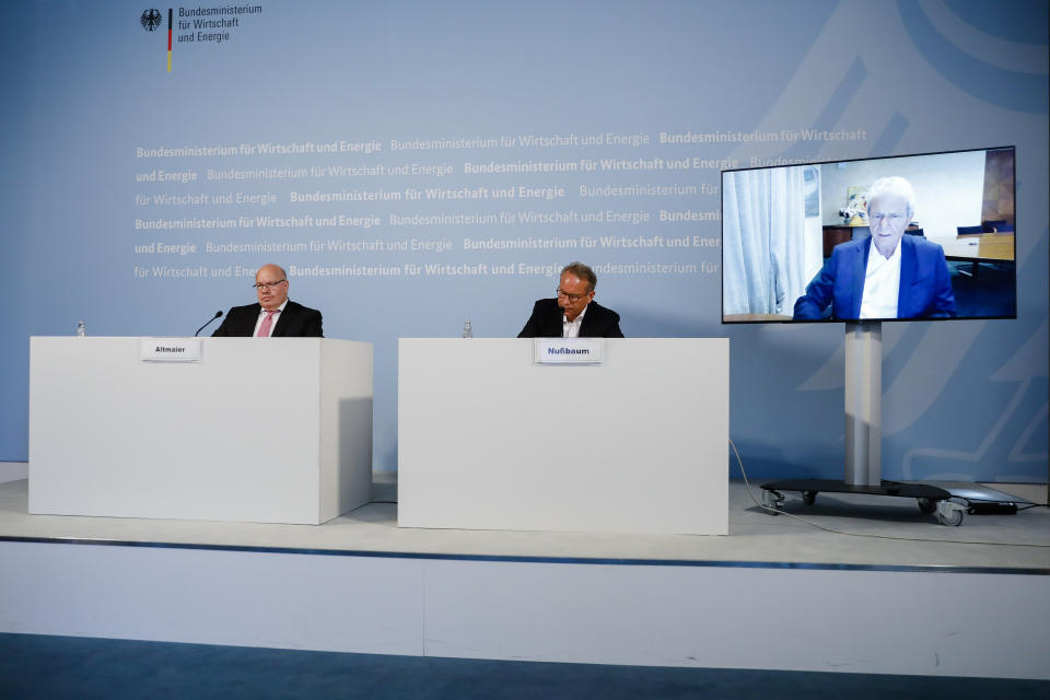 German Economy Minister Peter Altmaier (L), and state secretary at the economic ministry Ulrich Nussbaum (R) attend a news conference with with CureVac main shareholder Dietmar Hopp (on the screen right) at the economy ministry in Berlin on June 15, 2020. - The German government is taking a 23 percent stake in the German company CureVac working on a potential vaccine for the novel coronavirus. (Photo by Markus Schreiber / POOL / AFP) (Photo by MARKUS SCHREIBER/POOL/AFP via Getty Images)