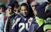 Seattle Seahawks fans stand bundled against the cold as they wait for the Super Bowl champions parade to begin Wednesday, Feb. 5, 2014, in Seattle. The Seahawks beat the Denver Broncos 43-8 in NFL football's Super Bowl XLVIII on Sunday.(AP Photo/Elaine Thompson)