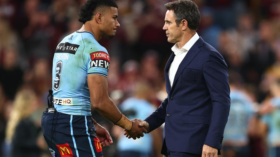 Brad Fittler shakes hands with Blues player Stephen Crichton after Origin III.