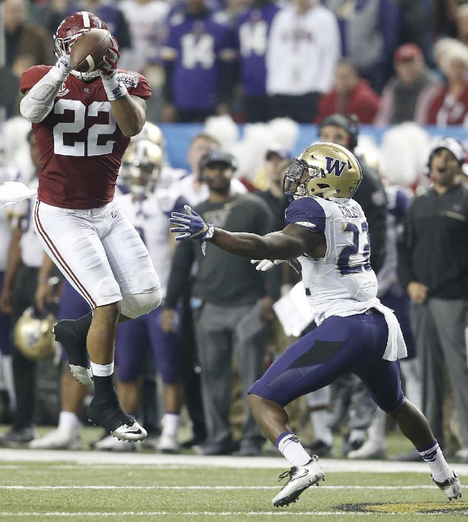 Alabama linebacker Ryan Anderson (22) picks off a pass intended for Washington running back Lavon Coleman (22) during the first half of the Peach Bowl NCAA college football playoff game, Saturday, Dec. 31, 2016, in Atlanta. (AP Photo/Skip Martin)