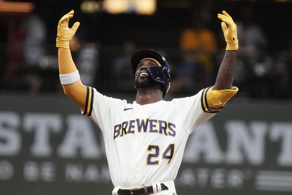 Milwaukee Brewers' Andrew McCutchen reacts after hitting an RBI double during the fifth inning of a baseball game against the St. Louis Cardinals Wednesday, June 22, 2022, in Milwaukee. (AP Photo/Morry Gash)