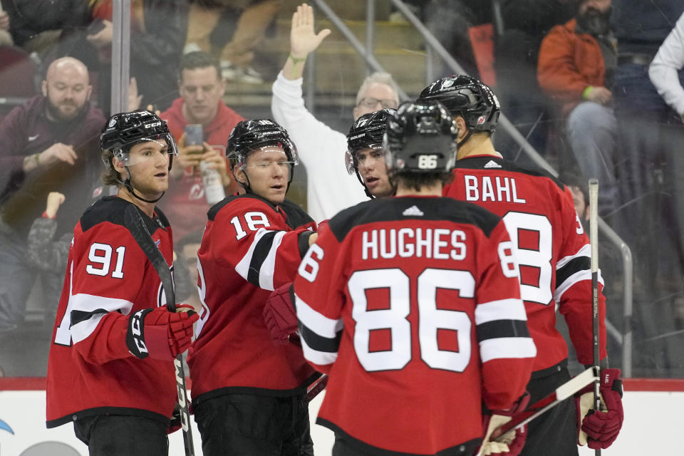 New Jersey Devils left wing Ondrej Palat (18) celebrates with his teammates after scoring against the Montreal Canadiens during the second period of an NHL hockey game, Saturday, Feb. 24, 2024, in Newark, N.J. (AP Photo/Mary Altaffer)