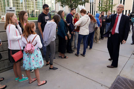 Jeff Colwell, Clerk of Court, gives instructions to Taylor Swift fans waiting to go into Denver Federal Court where the Taylor Swift groping trial goes on in Denver, U.S., August 14, 2017. REUTERS/Rick Wilking