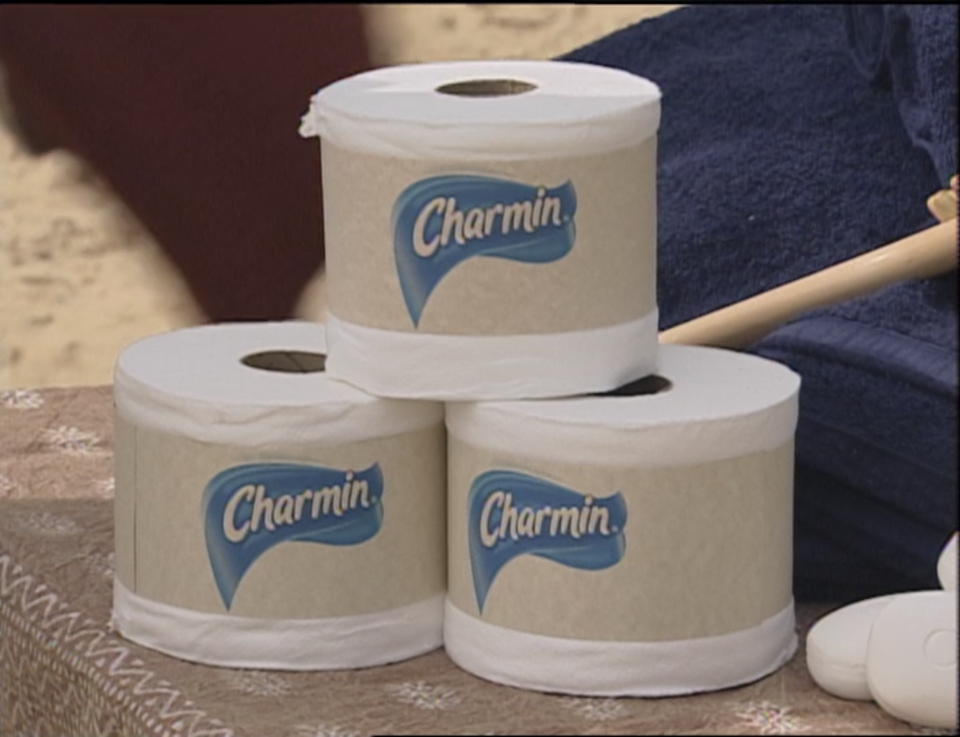 Three rolls of Charmin toilet paper