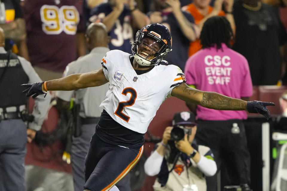 Chicago Bears wide receiver DJ Moore (2) celebrates a complete pass for a gain against the Washington Commanders during the first half of an NFL football game, Thursday, Oct. 5, 2023, in Landover, Md. (AP Photo/Andrew Harnik)