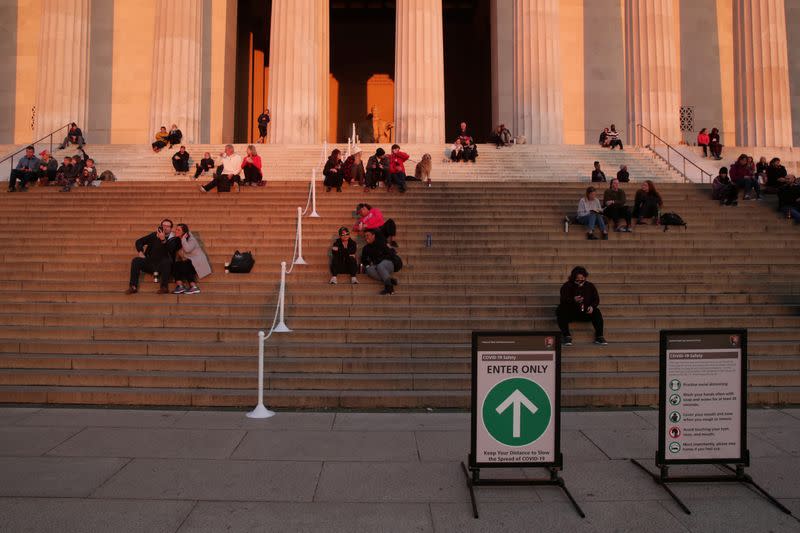 A few people take to the steps at the Lincoln Memorial during the coronavirus disease (COVID-19) outbreak, where normally thousands of Christians would gather for worship at Easter sunrise, in Washington