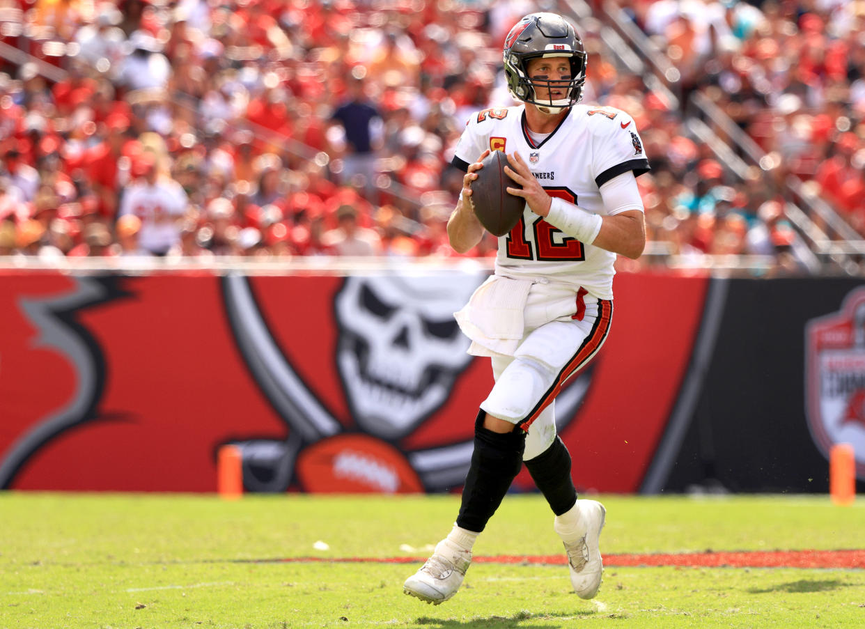 TAMPA, FLORIDA - OCTOBER 10: Tom Brady #12 of the Tampa Bay Buccaneers looks to pass during the third quarter against the Miami Dolphins at Raymond James Stadium on October 10, 2021 in Tampa, Florida. (Photo by Mike Ehrmann/Getty Images)