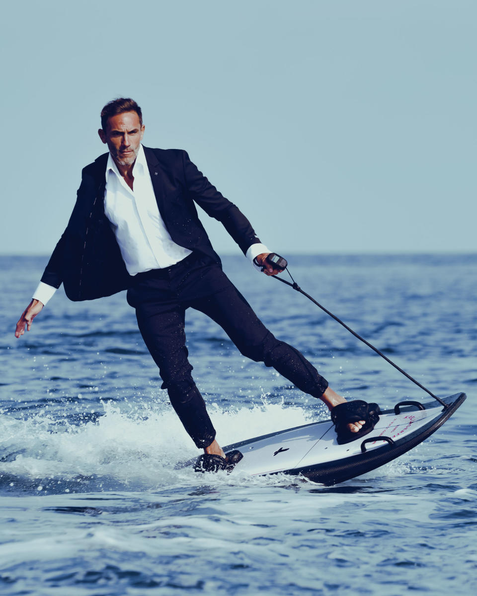 Sébastien Jondeau riding an electric surfboard. - Credit: Courtesy