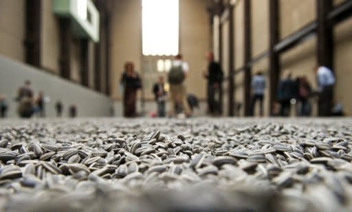 Chinese artist Ai Weiwei's "Sunflower Seeds" is made up of around 100 million individually crafted ceramic 'seeds'. Ai Weiwei is not permitted to leave Beijing "without permission", authorities said after his release from nearly three months of custody that triggered an international outcry