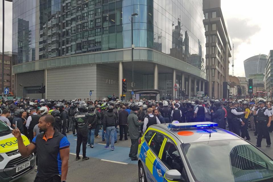 Scores of Uber Eats drivers stage a protest over pay outside the company's offices in Aldgate East, London (PA)